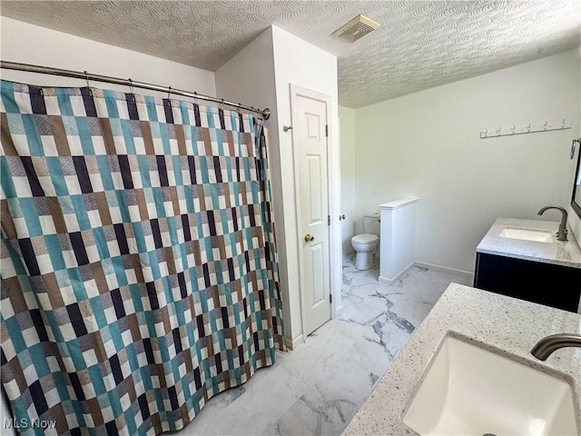 5123 Glenbrook Dr, Vienna, WV 26105 - full bath with marble finish floors, double vanity, a textured ceiling, and curtained shower