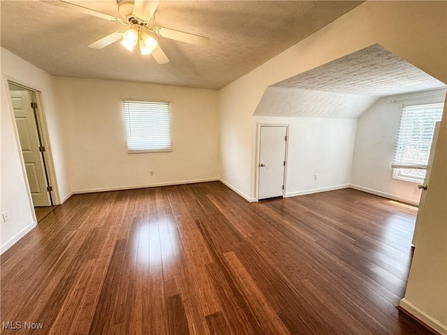 5123 Glenbrook Dr, Vienna, WV 26105 - additional living space featuring plenty of natural light, a textured ceiling, dark wood finished floors, ceiling fan, and vaulted ceiling