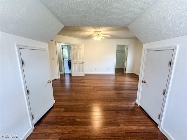 5123 Glenbrook Dr, Vienna, WV 26105 - unfurnished bedroom with wood finished floors, lofted ceiling, a walk in closet, a ceiling fan, and a closet