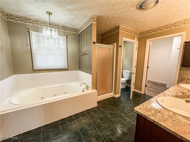 5123 Glenbrook Dr, Vienna, WV 26105 - full bath featuring a jetted tub, a stall shower, a chandelier, double vanity, and tile patterned flooring