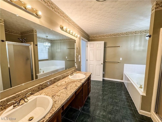 5123 Glenbrook Dr, Vienna, WV 26105 - full bathroom featuring a stall shower, a garden tub, double vanity, a textured ceiling, and tile patterned floors