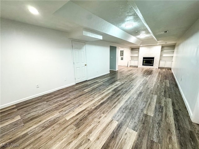 5123 Glenbrook Dr, Vienna, WV 26105 - unfurnished living room with wood finished floors, a fireplace, and built in shelves