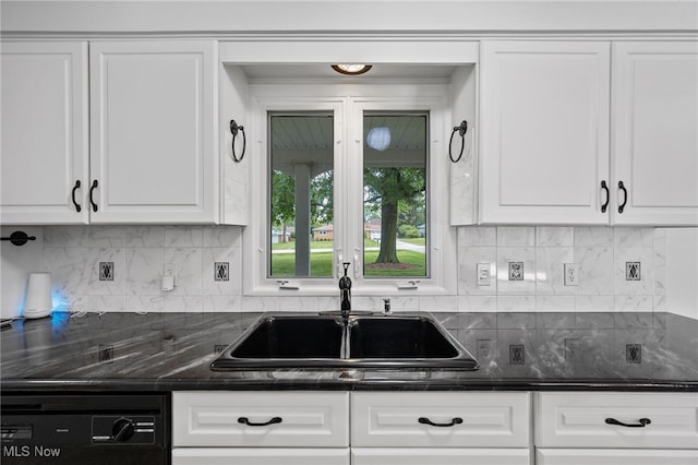 3612 Vezber Dr, Seven Hills, OH 44131 - kitchen with black dishwasher, white cabinetry, decorative backsplash, and dark stone countertops