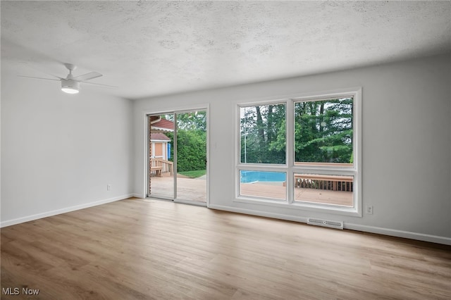 3612 Vezber Dr, Seven Hills, OH 44131 - empty room featuring wood finished floors, a textured ceiling, and ceiling fan