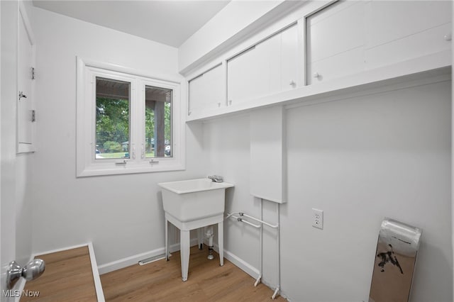3612 Vezber Dr, Seven Hills, OH 44131 - washroom with light wood-type flooring and cabinet space
