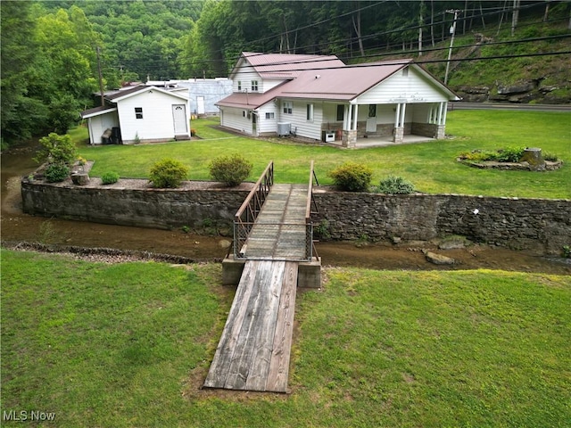 13088 Clay Hwy, Lizemores, WV 25125 - rear view of property with a wooded view and a yard