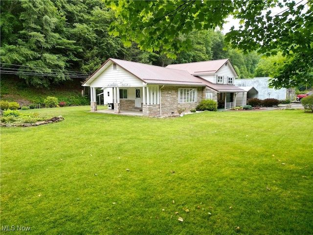 13088 Clay Hwy, Lizemores, WV 25125 - view of front of property featuring stone siding, a front lawn, a porch, and a metal roof