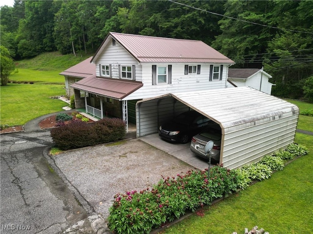 13088 Clay Hwy, Lizemores, WV 25125 - view of front of property featuring driveway, a front yard, a carport, and a forest view