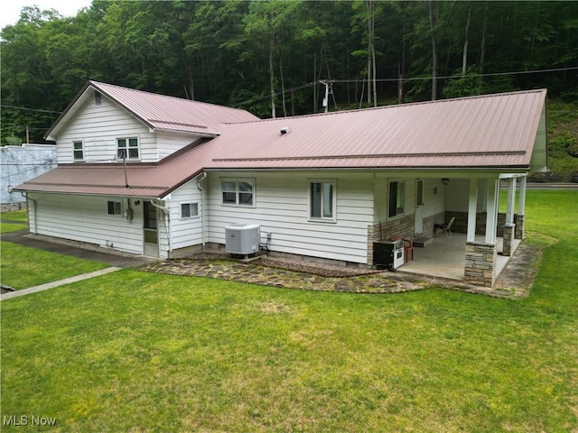 13088 Clay Hwy, Lizemores, WV 25125 - back of house with a view of trees, a yard, a metal roof, and a porch