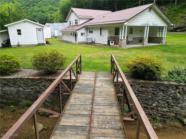 13088 Clay Hwy, Lizemores, WV 25125 - back of house with a metal roof and a yard