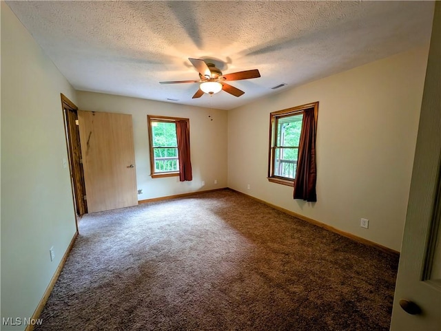 963 Ivydale Rd, Clay, WV 25043 - carpeted empty room featuring a ceiling fan and a textured ceiling