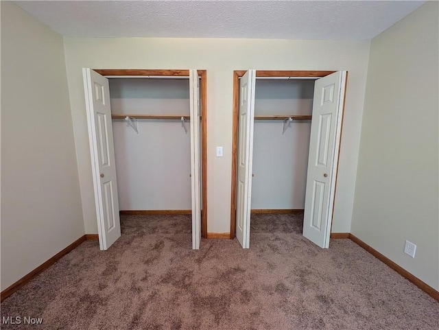 963 Ivydale Rd, Clay, WV 25043 - unfurnished bedroom with multiple closets and carpet