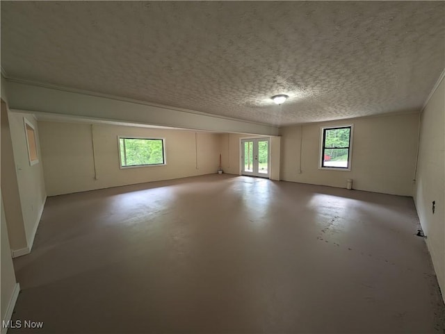 963 Ivydale Rd, Clay, WV 25043 - spare room featuring finished concrete flooring and a textured ceiling