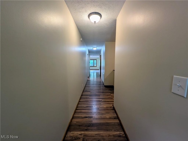 963 Ivydale Rd, Clay, WV 25043 - corridor with a textured ceiling and dark wood-style floors