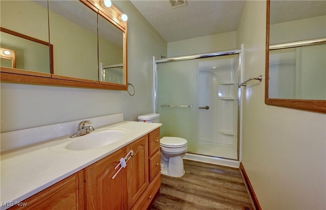 816 Vincent Dr, Loudonville, OH 44842 - bathroom featuring wood finished floors, a shower with door, and vanity