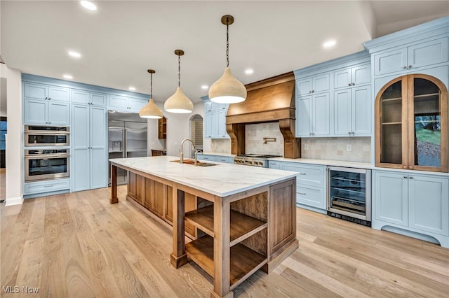 2705 Rocky Ridge Dr, Westlake, OH 44145 - kitchen with wine cooler, stainless steel appliances, premium range hood, tasteful backsplash, and recessed lighting