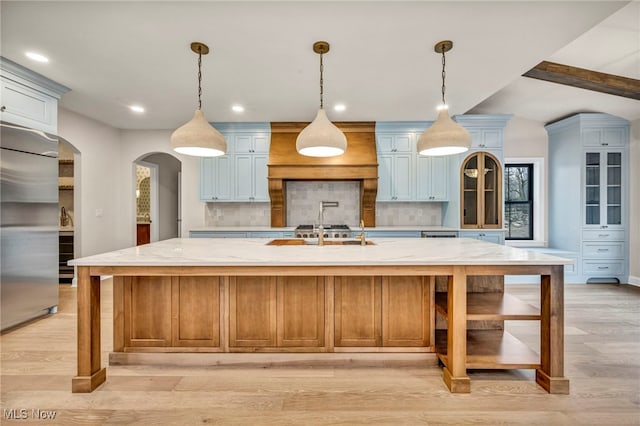 2705 Rocky Ridge Dr, Westlake, OH 44145 - kitchen with stainless steel built in refrigerator, decorative backsplash, recessed lighting, custom exhaust hood, and light stone counters