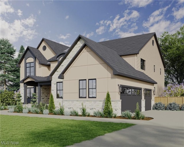 2705 Rocky Ridge Dr, Westlake, OH 44145 - view of front facade with stone siding, driveway, a front yard, and a shingled roof