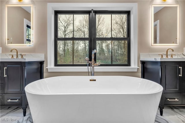 2705 Rocky Ridge Dr, Westlake, OH 44145 - full bathroom featuring marble look tiles, vanity, and plenty of natural light