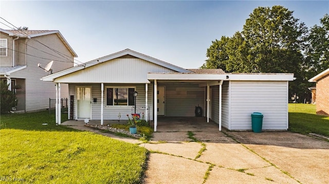 204 W 8 1/2 St, Williamstown, WV 26187 - view of front of property with concrete driveway, a front yard, an attached carport, and covered porch