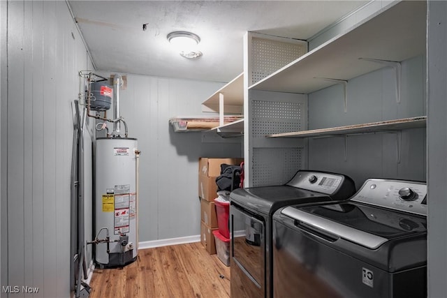 204 W 8 1/2 St, Williamstown, WV 26187 - washroom featuring water heater, separate washer and dryer, and light wood finished floors