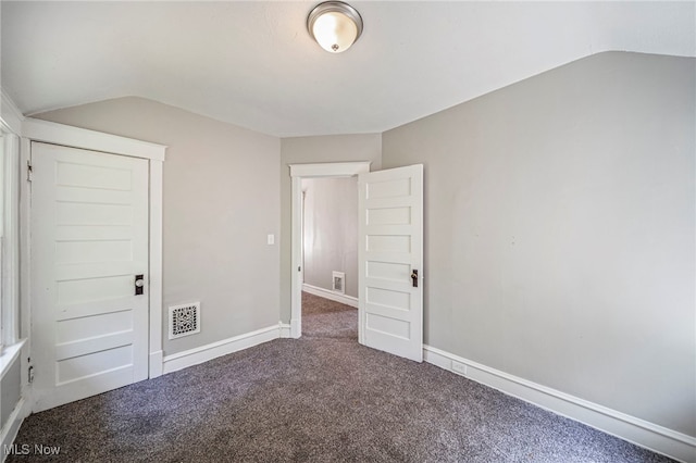 12525 Lancelot Ave, Cleveland, OH 44108 - unfurnished bedroom with lofted ceiling and carpet floors