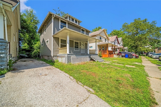12525 Lancelot Ave, Cleveland, OH 44108 - american foursquare style home featuring covered porch, driveway, and a front yard