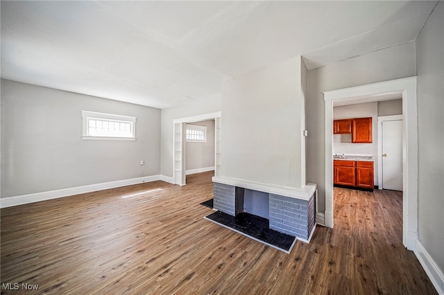 12525 Lancelot Ave, Cleveland, OH 44108 - unfurnished living room with dark wood-style flooring and baseboards