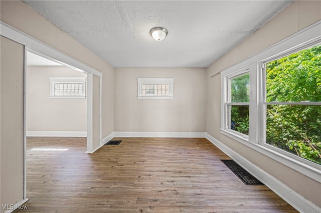 12525 Lancelot Ave, Cleveland, OH 44108 - spare room featuring wood finished floors and a textured ceiling