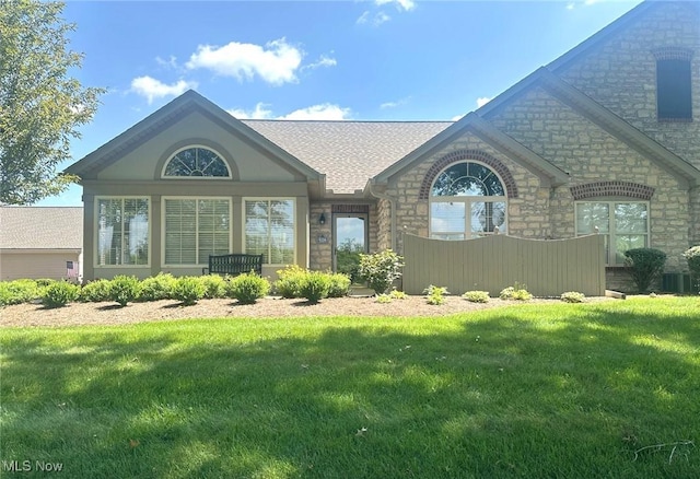 5-118 The Flds, Williamstown, WV 26187 - view of front facade featuring stone siding and a front lawn