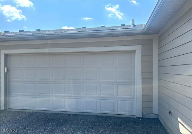 5-118 The Flds, Williamstown, WV 26187 - garage featuring asphalt driveway