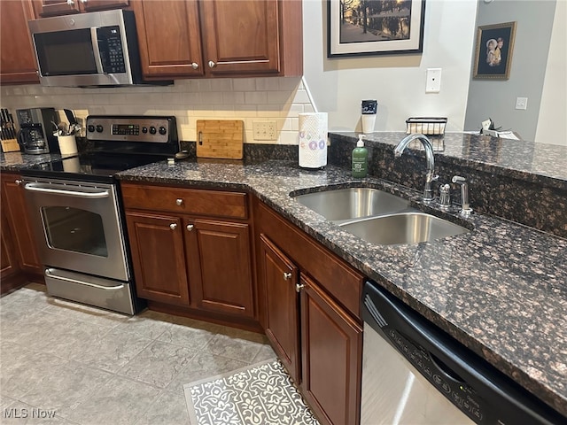 5-118 The Flds, Williamstown, WV 26187 - kitchen featuring stainless steel appliances, dark stone counters, and decorative backsplash