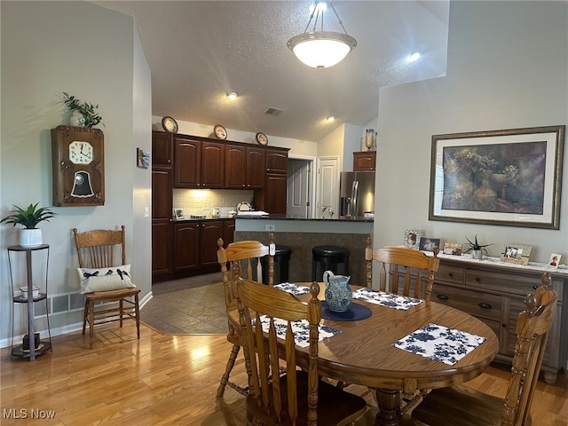 5-118 The Flds, Williamstown, WV 26187 - dining room with light wood-type flooring and vaulted ceiling