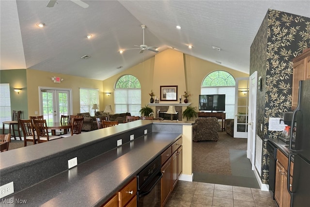 5-118 The Flds, Williamstown, WV 26187 - kitchen with a ceiling fan, french doors, open floor plan, dark countertops, and vaulted ceiling