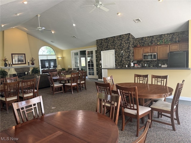 5-118 The Flds, Williamstown, WV 26187 - dining space with ceiling fan, dark carpet, and lofted ceiling