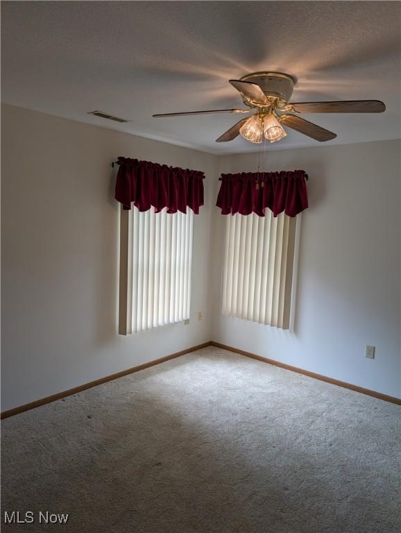 4220 Tannybrooke Ln NW Unit 13C, Canton, OH 44718 - carpeted empty room featuring baseboards and ceiling fan