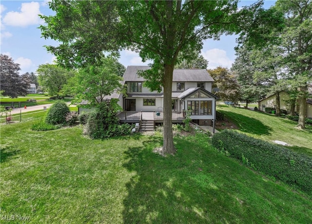 118 Steeplechase Ln, Munroe Falls, OH 44262 - back of property featuring a yard, a wooden deck, and a sunroom