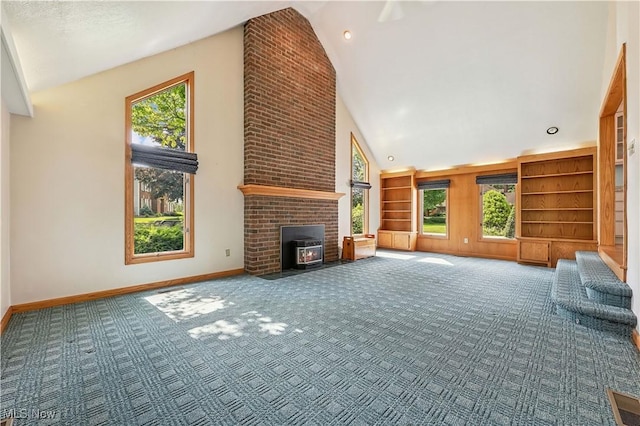 118 Steeplechase Ln, Munroe Falls, OH 44262 - unfurnished living room featuring high vaulted ceiling, carpet, and built in shelves