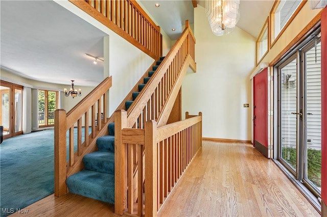 118 Steeplechase Ln, Munroe Falls, OH 44262 - staircase featuring a chandelier and wood finished floors