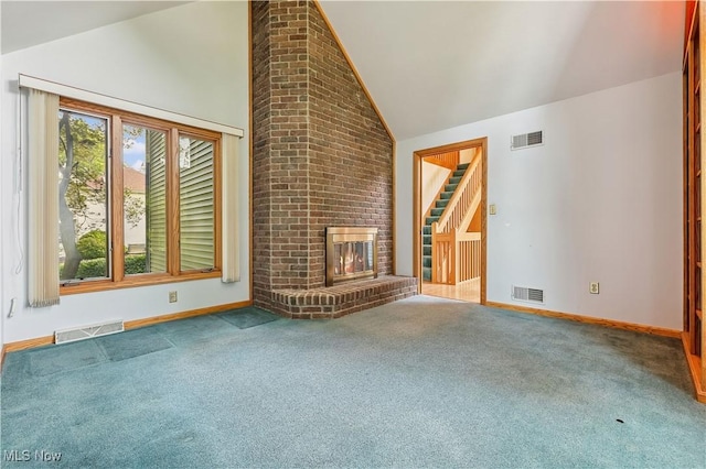118 Steeplechase Ln, Munroe Falls, OH 44262 - unfurnished living room with carpet flooring, a fireplace, and high vaulted ceiling