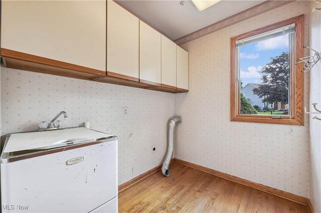 118 Steeplechase Ln, Munroe Falls, OH 44262 - washroom featuring cabinet space, light wood-style flooring, and wallpapered walls