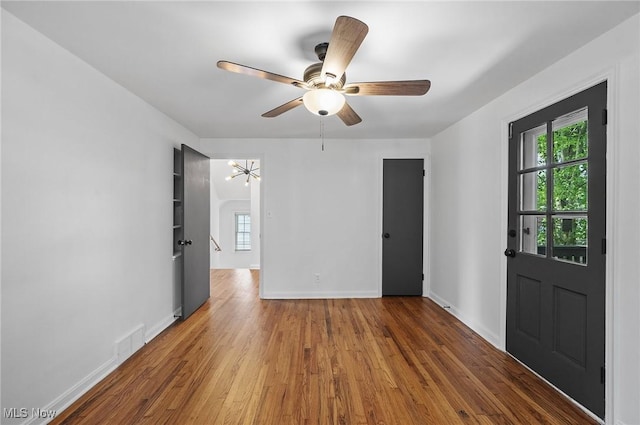 3722 Avalon Rd, Shaker Heights, OH 44120 - spare room with plenty of natural light, wood finished floors, a chandelier, and ceiling fan