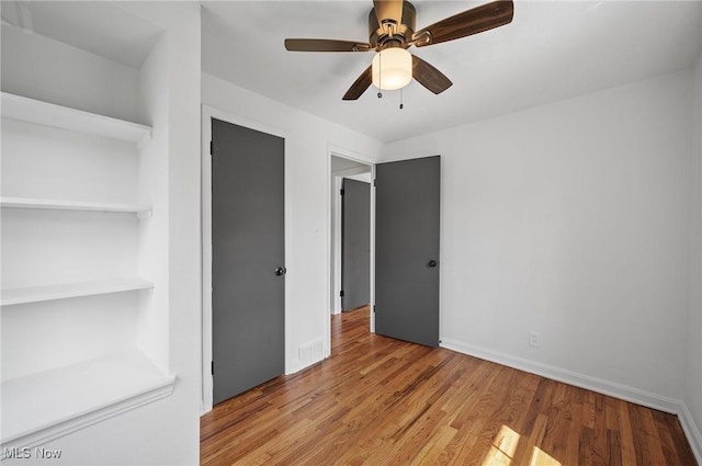 3722 Avalon Rd, Shaker Heights, OH 44120 - unfurnished bedroom with light wood finished floors and a ceiling fan