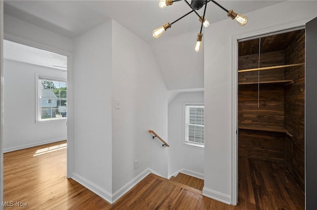 3722 Avalon Rd, Shaker Heights, OH 44120 - staircase with wood finished floors and a chandelier