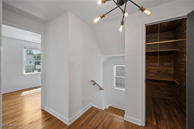 3722 Avalon Rd, Shaker Heights, OH 44120 - staircase with wood finished floors and a chandelier