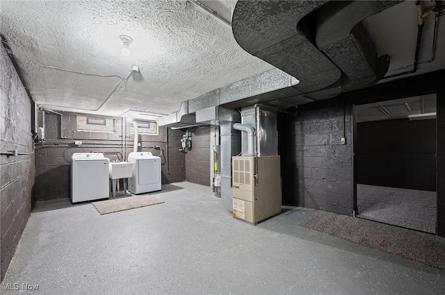 3722 Avalon Rd, Shaker Heights, OH 44120 - unfinished basement with washing machine and clothes dryer, heating unit, and water heater