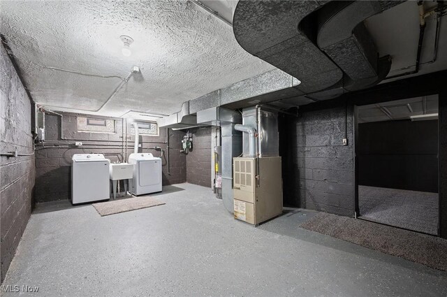 3722 Avalon Rd, Shaker Heights, OH 44120 - unfinished basement with washing machine and clothes dryer, heating unit, and water heater