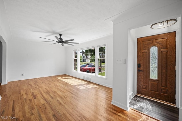 3722 Avalon Rd, Shaker Heights, OH 44120 - foyer with light wood-type flooring, arched walkways, and a ceiling fan
