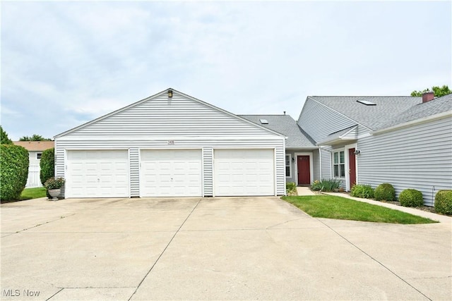 3406 Ivy Hill Cir Unit B, Cortland, OH 44410 - view of front of property featuring driveway and a garage