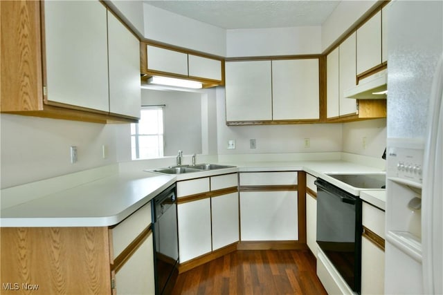 3406 Ivy Hill Cir Unit B, Cortland, OH 44410 - kitchen with under cabinet range hood, white appliances, dark wood-style flooring, and light countertops